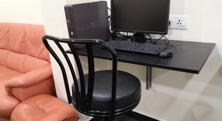 a desk with a laptop computer and a chair, Hotel Sunjoy9 @ Mid Valley in Kuala Lumpur