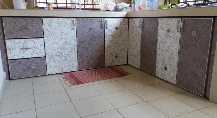 a bathroom with a sink and a counter top, Seri BaQti Homestay in Tanah Merah
