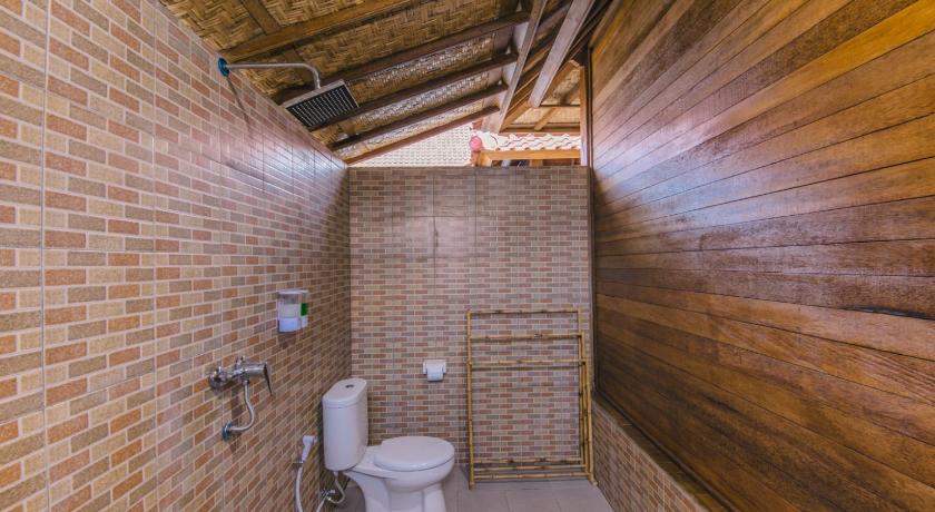 a bathroom with a toilet and a sink in it, Nerima Hut Lembongan in Bali