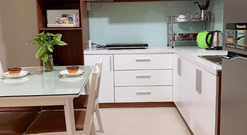 a kitchen with white cabinets and white appliances, Masteri Apartment 2BR in Ho Chi Minh City