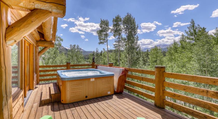 a wooden deck with a large pool of water, Robbers Nest in Breckenridge (CO)