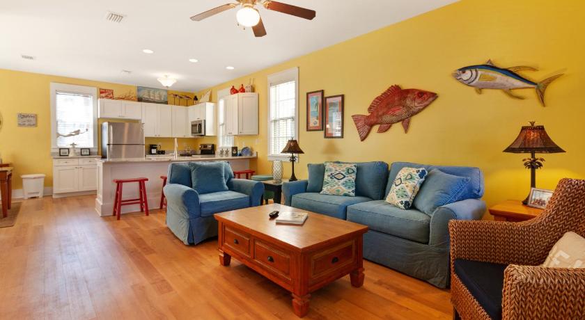 a living room filled with furniture and a couch, Barefoot Cottages #B22 in Port Saint Joe