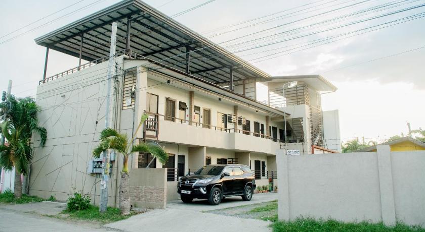 a car parked in front of a building, Mailz Haven #6 2BR Cozy Apartment 750m Near SM in Davao City