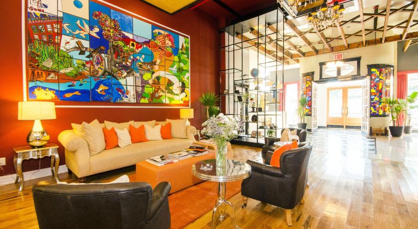 a living room filled with furniture and a painting on the wall, The Box House Hotel - Adults Only in New York (NY)