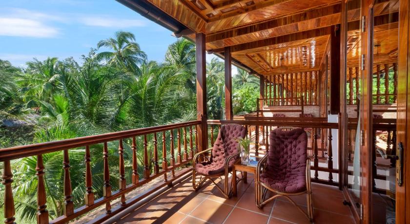 a large balcony overlooking a lush green forest, Coco Palm Beach Resort & Spa in Phu Quoc Island