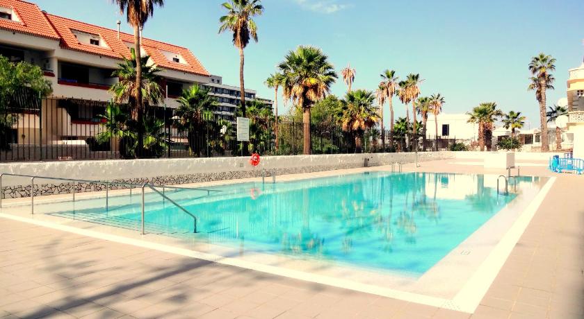 Spotless south facing apartment with pool view and WIFI heart of Las Americas photo