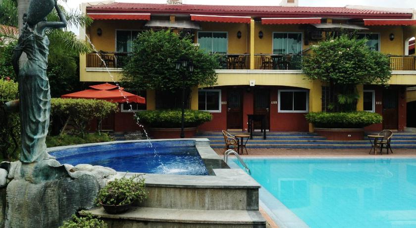 a house with a pool and a swimming pool, Crown Regency Residences Davao Hotel in Davao City