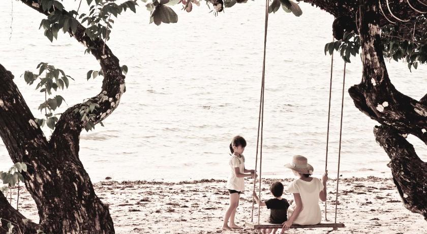 a woman and a child standing on a beach, GajaPuri Resort Koh Chang (SHA Extra Plus) in Koh Chang