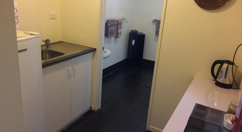 a bathroom with a toilet and a sink, Manor Views in Huntly