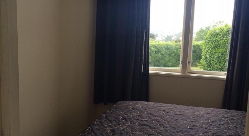 a bedroom with a bed and a window, Manor Views in Huntly