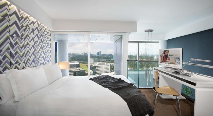 a hotel room with a bed and a tv, Citadines Fusionopolis Singapore (SG Clean Certified) in Singapore