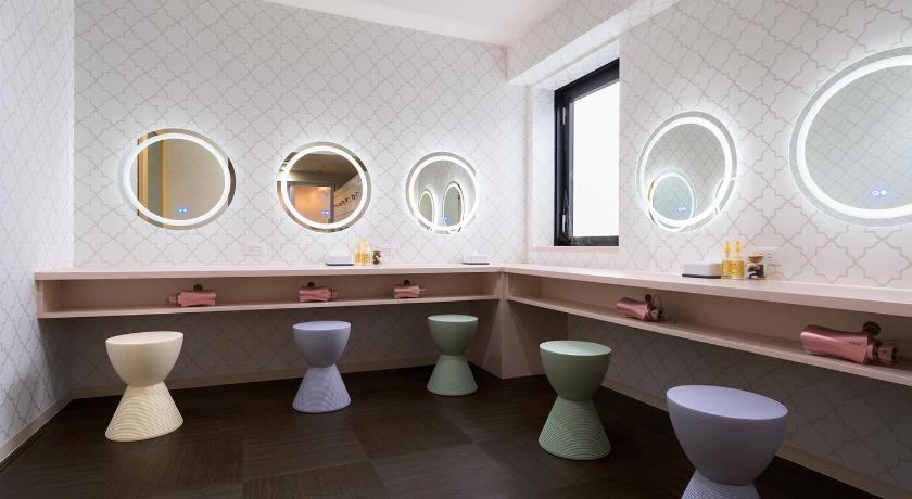 a bathroom with a toilet, sink and mirror, Hotel Morning Box Osaka Shinsaibashi in Osaka
