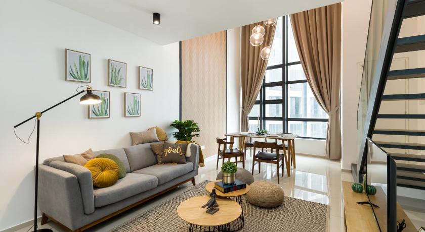 a living room filled with furniture and a large window, EkoCheras Premium Suites in Kuala Lumpur