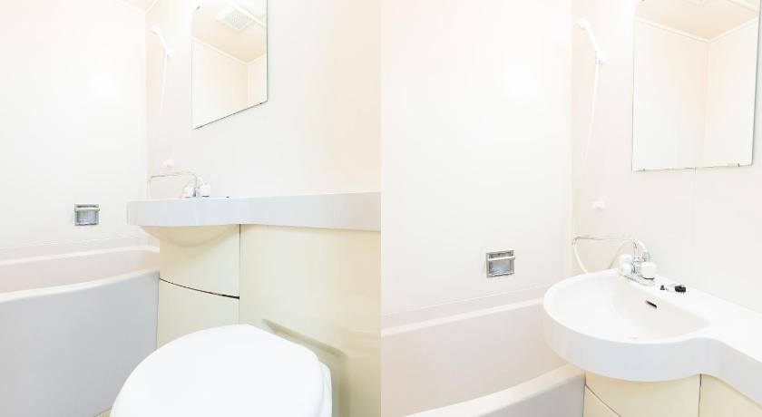 a white toilet sitting next to a sink in a bathroom, Hotel TOKA Edogawa Hirai in Tokyo