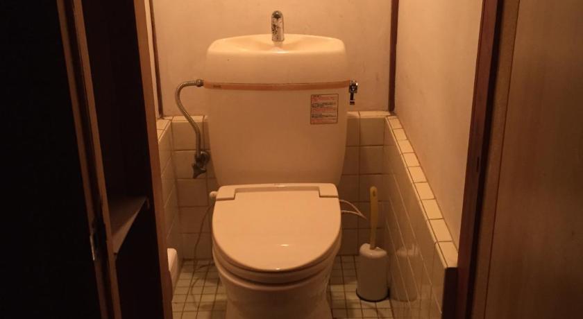 a bathroom with a toilet and a sink, Kumano Winery Guest House in Tanabe