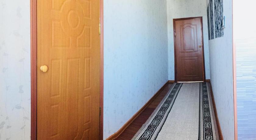 a doorway leading to a room with a door open, BULBUL JAMAK TRAVEL hostel in Olgii