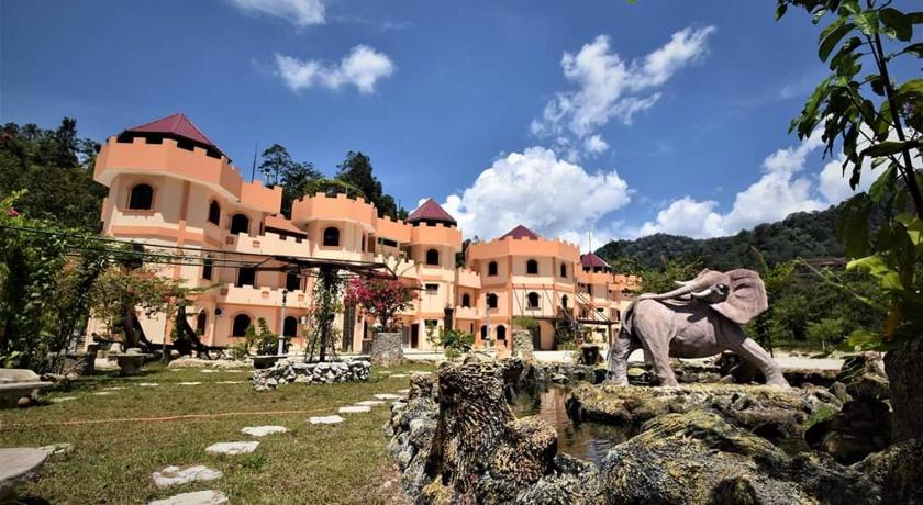 a large stone building with a bunch of animals on top of it, Lake Castle in Sungai Lembing
