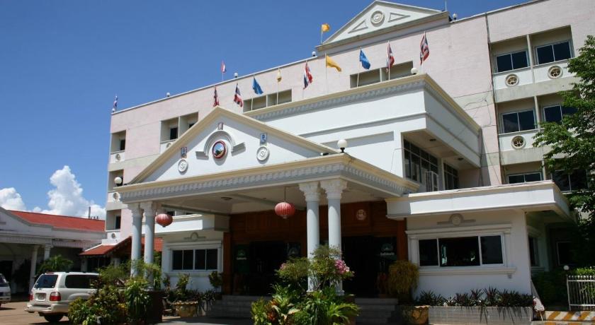 a large white building with a clock on the front of it, Sakol Grand Palace Hotel in Sakon Nakhon