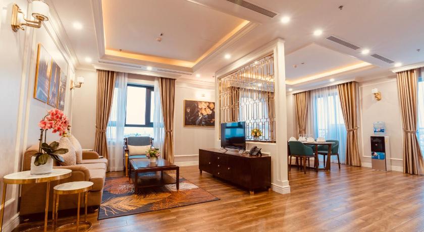 a living room filled with furniture and a large window, Victory Hotel and Apartment in Haiphong