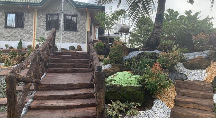 a row of wooden stairs leading up to a house, Michaels Homestay - Farm Villa nr Patar Beach & Bolinao Falls in Laguna