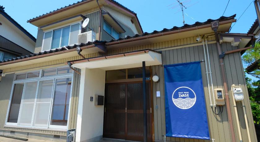 a building with a sign on the front of it, Guesthouse Iwase in Toyama