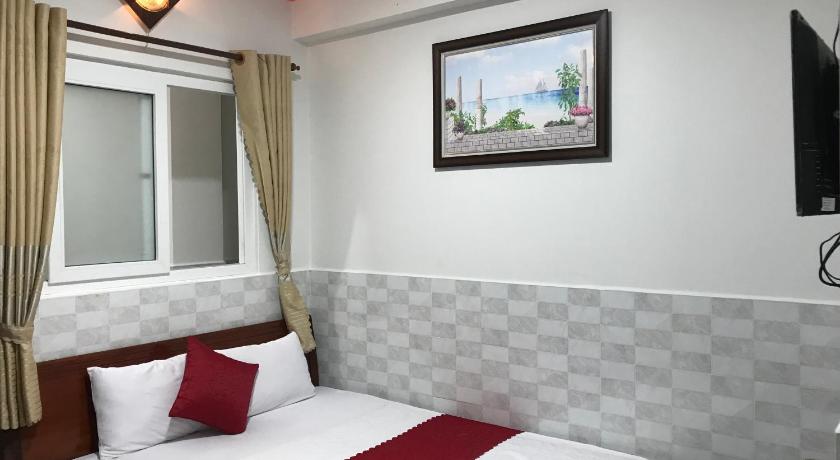 a hotel room with a white bed and white walls, GOLD HOTEL in Vung Tau