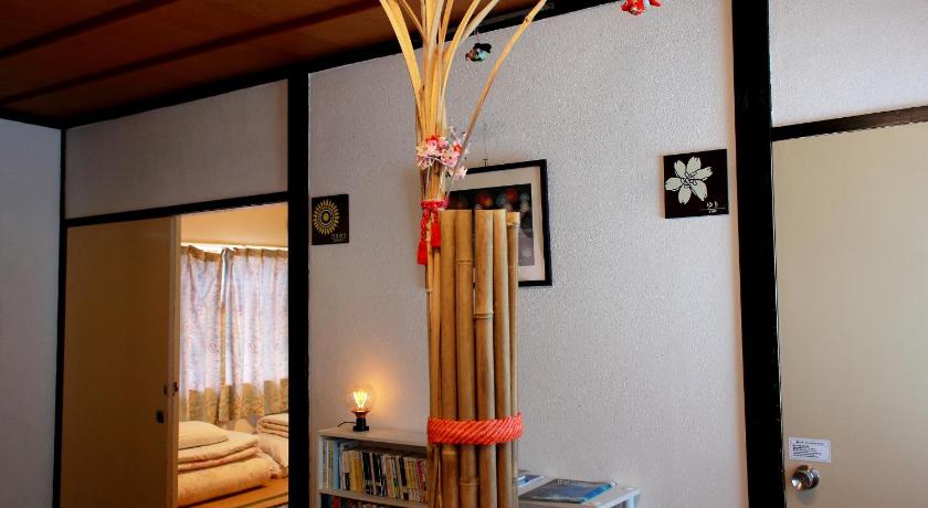 a lamp hanging from a ceiling in a room, Oyado Hana in Nachikatsuura