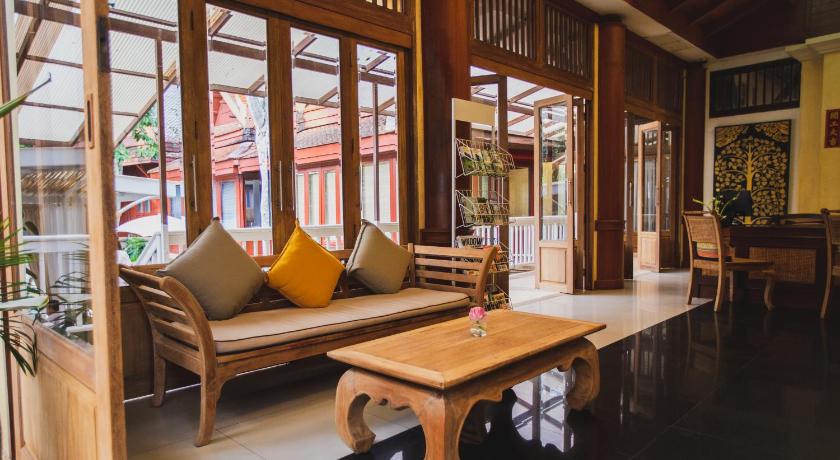 a living room filled with furniture and a large window, Ma  Doo  Bua  Phuket (SHA Extra Plus) in Phuket