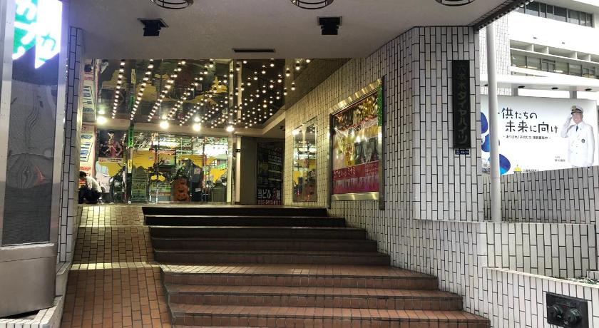 a walkway with stairs leading to a stair case, Roppongi Plaza Hotel in Tokyo