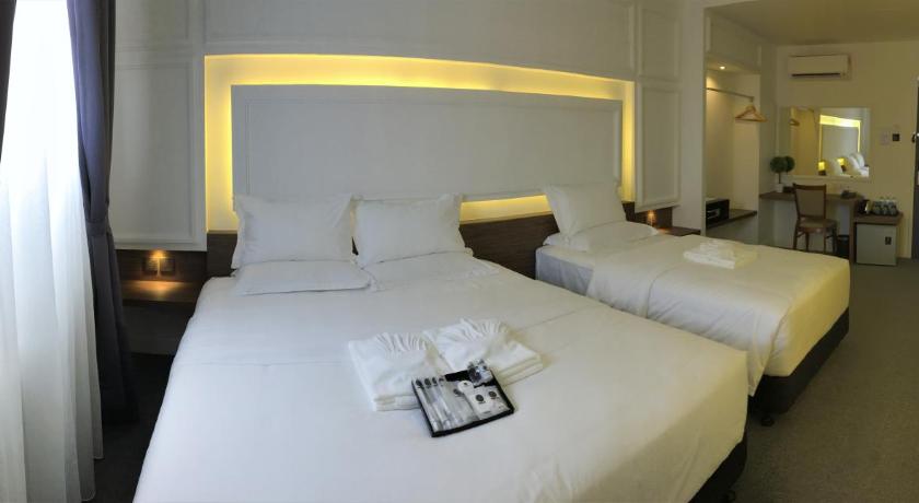 a hotel room with two beds and two lamps, TheBlanc Boutique Hotel in Malacca