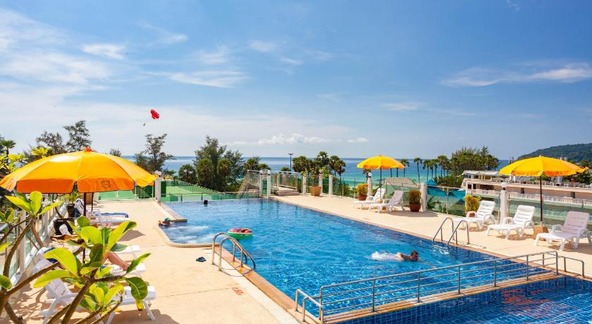 a beach with umbrellas and a pool, Baumancasa Beach Resort in Phuket