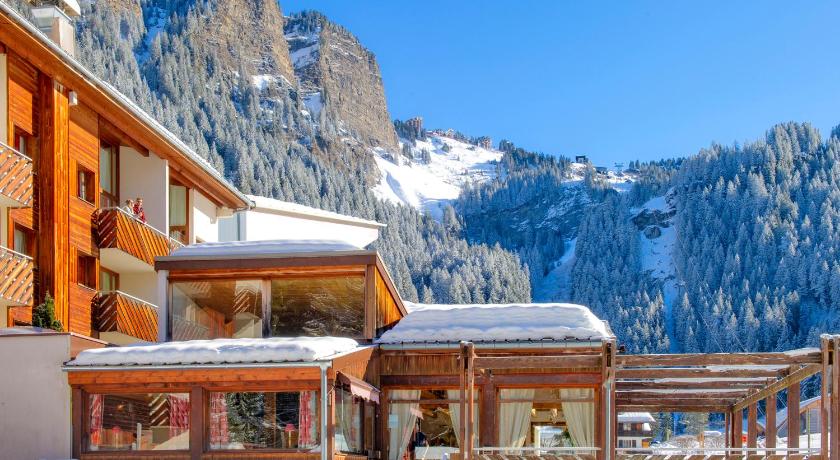 snow covered buildings and a mountain range, Residence Capfun du Telepherique, Morzine in Morzine