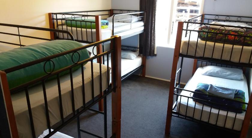 a bedroom with two bunk beds and two bunk beds in it, Annies Nirvana Lodge, Golden Bay YHA in Golden Bay
