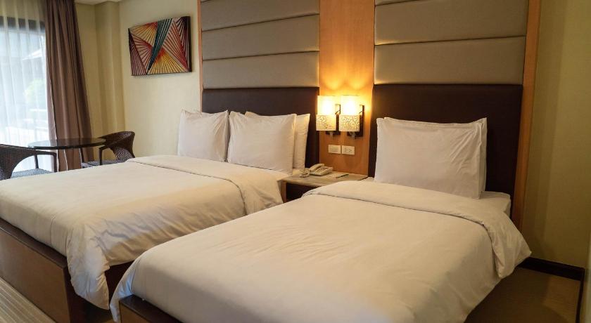 a hotel room with two beds and two lamps, Cebu Westown Lagoon - South Wing in Cebu