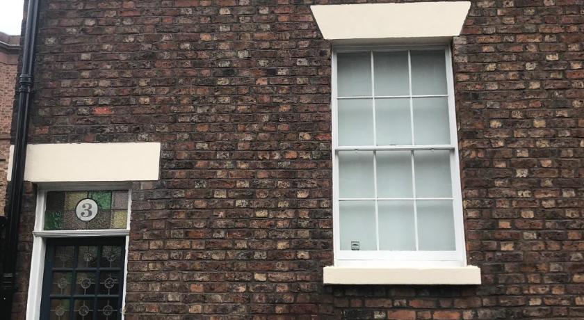 a large brick building with a window, The Captains House in Liverpool