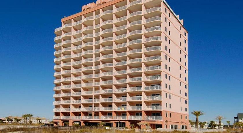 a large building with a large window on top, Royal Palms by Bender Vacation Rentals in Gulf Shores (AL)