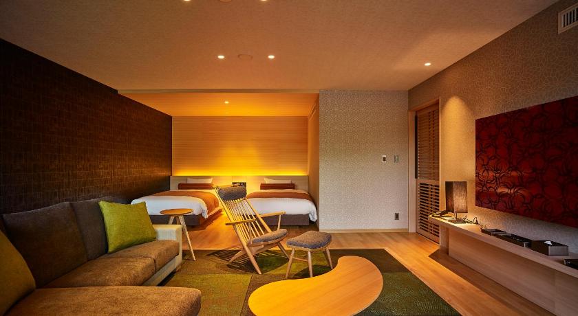 a living room filled with furniture and a couch, Hotel Nakanoshima in Nachikatsuura