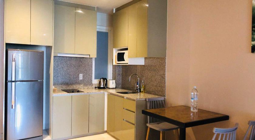 a kitchen with a refrigerator, stove, sink, microwave and a table, Fuji Landmark 3 in Ho Chi Minh City