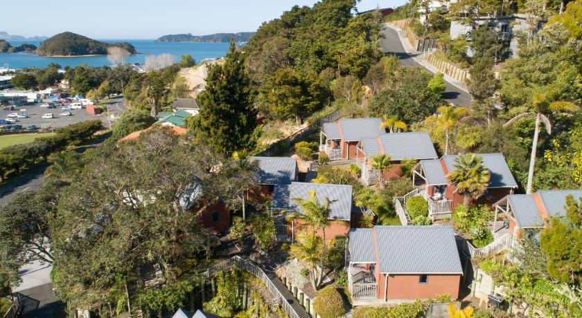 a house with trees and houses on top of it, Bay Cabinz Motel in Bay of Islands