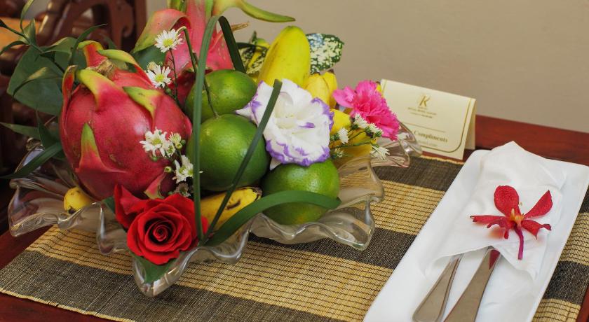 a vase filled with flowers on top of a table, Royal Hotel Saigon in Ho Chi Minh City