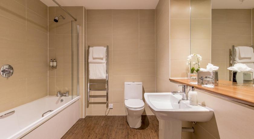 a bathroom with a sink, toilet, and bathtub, Stewart by Heeton Concept in Edinburgh