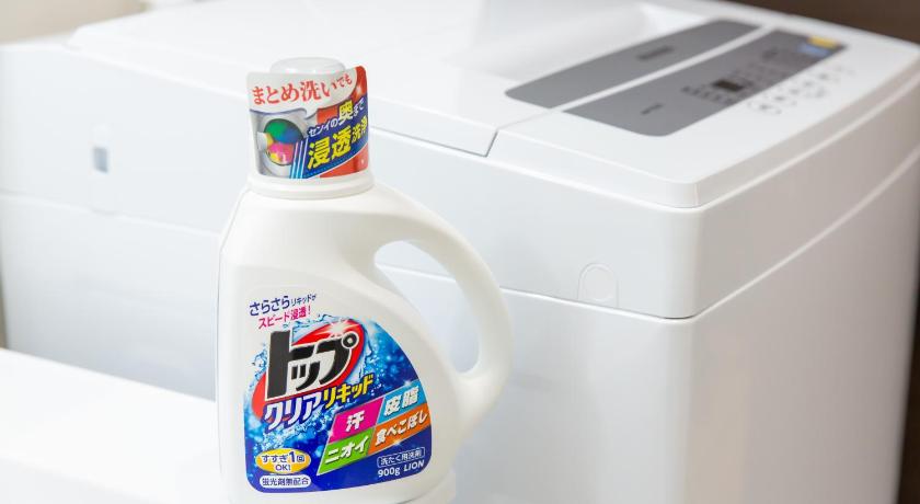 a bottle of milk sitting on top of a white refrigerator, Ryugu in Osaka