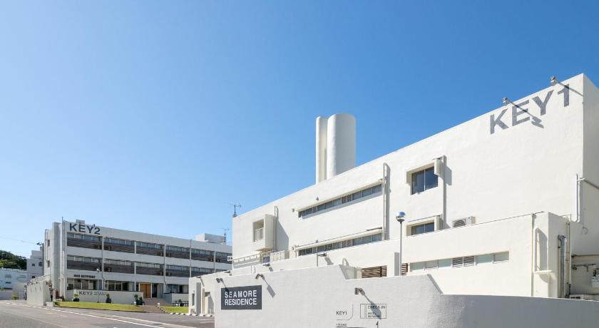 a large white building with a plane on top of it, SHIRAHAMA KEY TERRACE SEAMORE RESIDENCE in Shirahama