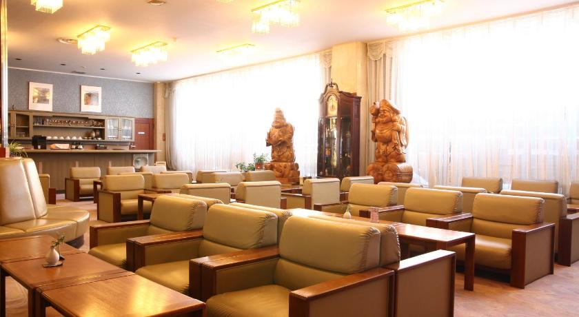 a living room filled with couches and chairs, Hotel Towadaso in Towada