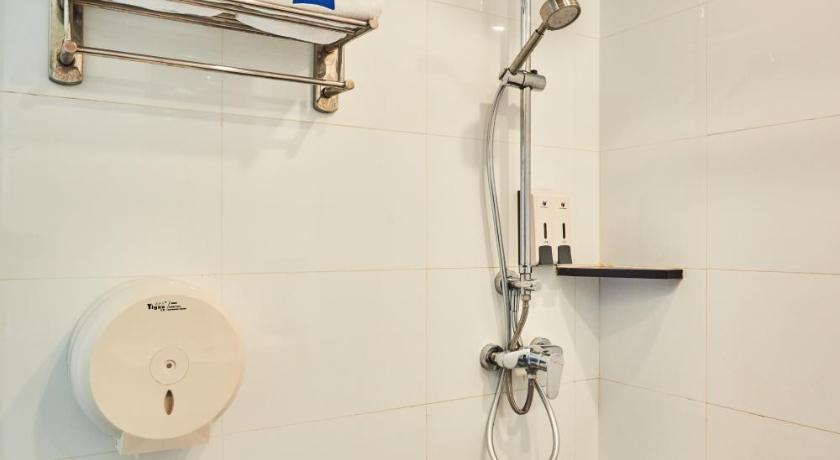a bathroom with a toilet and a shower stall, ibis budget Singapore Pearl (SG Clean Certified, Staycation Approved) in Singapore