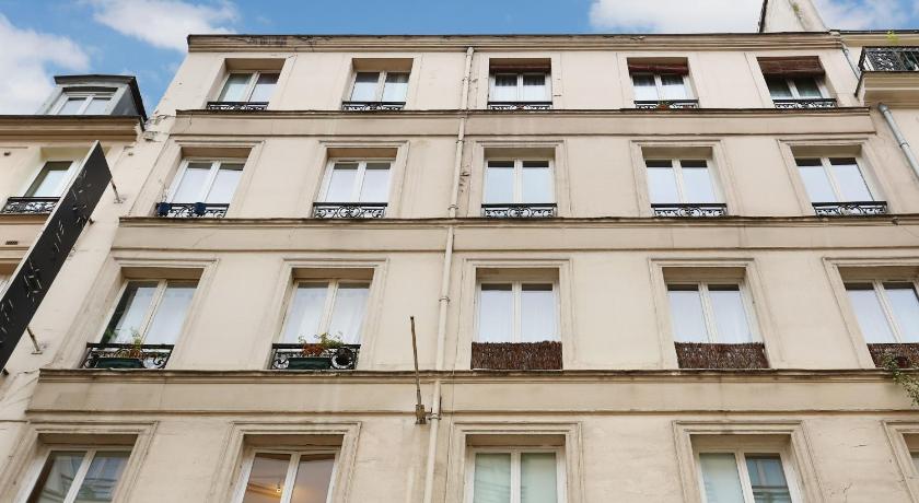 a large white building with windows, Residence Caire / Montorgueil in Paris