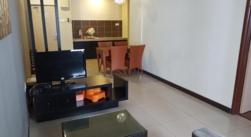 a living room filled with furniture and a tv, Bayou lagoon Muslim Apartment in Malacca