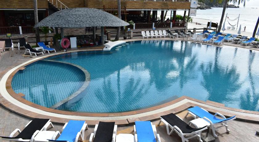 a pool with chairs and tables in it, Phangan Bayshore Resort (SHA Extra Plus) in Ko Pha-ngan