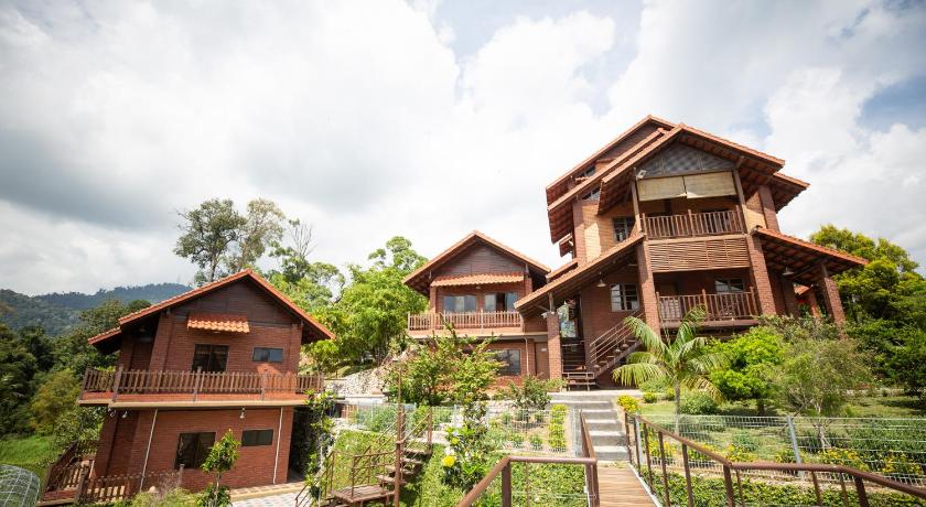 a large building with a view of a river, Red House the Garden Stay in Bentong
