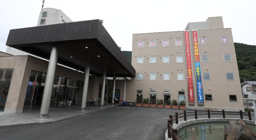 a large building with a large clock on the side of it, Kur and Hotel Isawa in Yamanashi